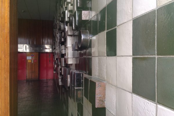 Side view of a ceramic wall mural by William Gordon in Strathclyde University